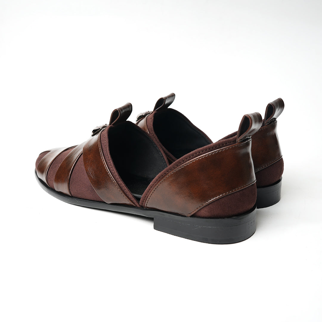 A pair of Monkstory Criss Cross Slip-On Sandals - Brown with elegant straps.