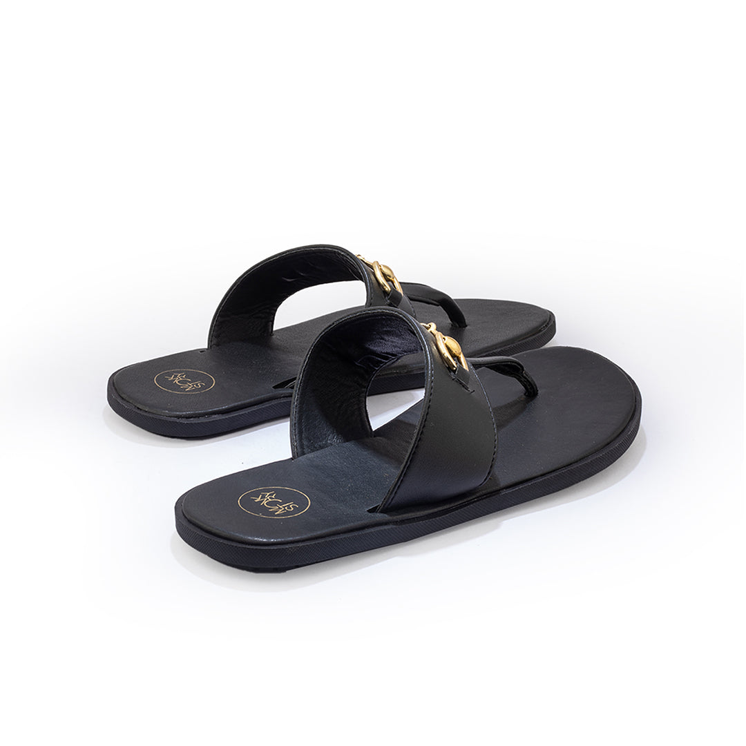A pair of Monkstory T-Rad Horsebit Sandals in black leather with a gold buckle.