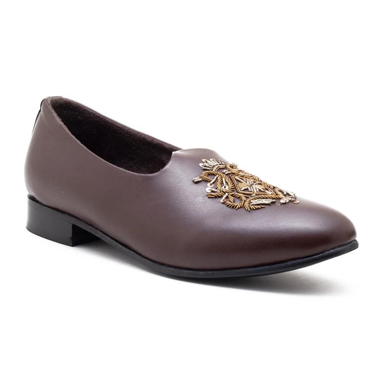 A pair of Monkstory Magenta Mojri shoes with brown embroidered designs.