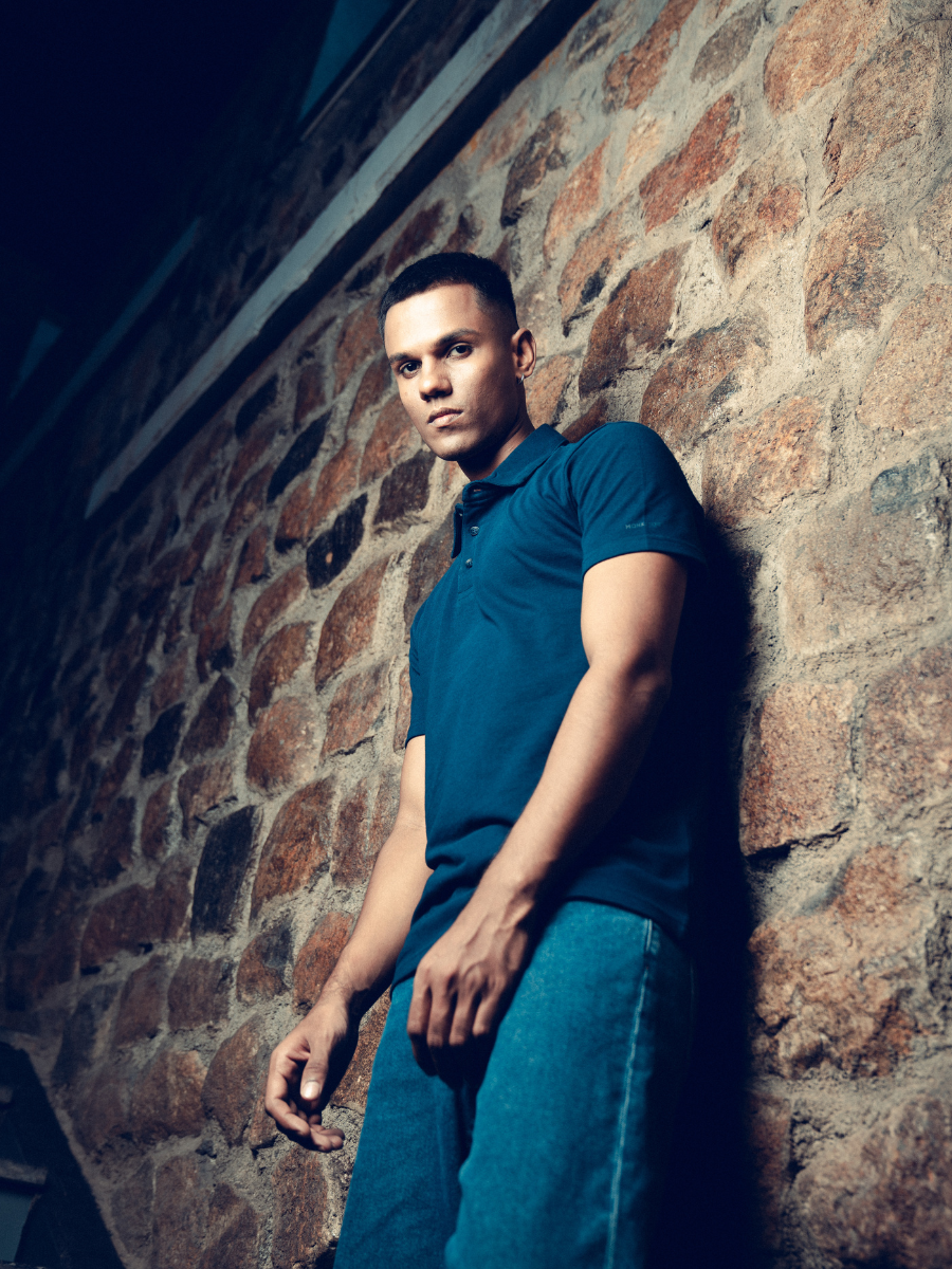 A man in a comfortable Monkstory Bamboo Cotton Polo Tee - Navy Blue posing for a photo.