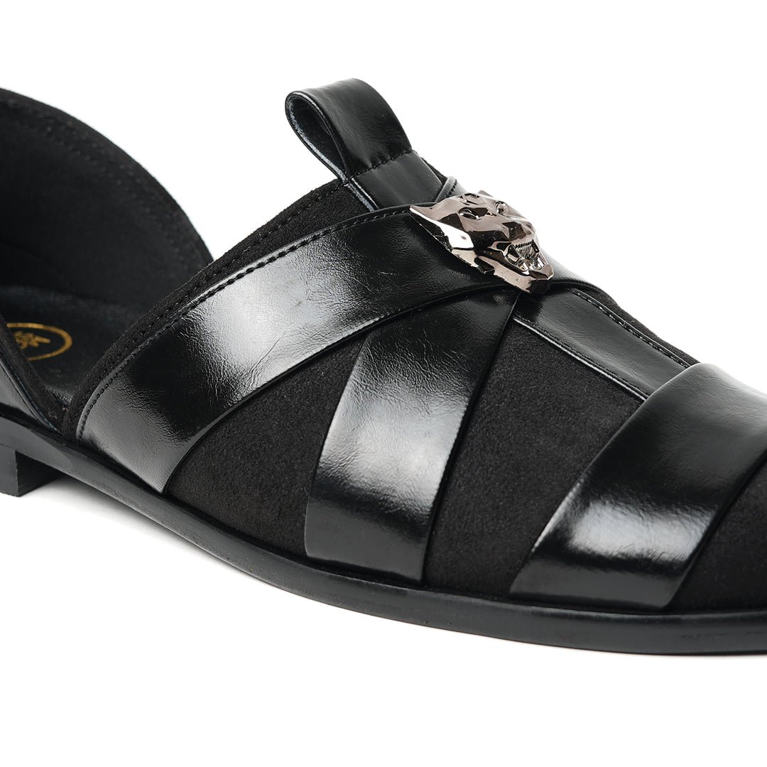 A sophisticated Monkstory Criss Cross Slip-On Sandal - Black leather shoe with straps.