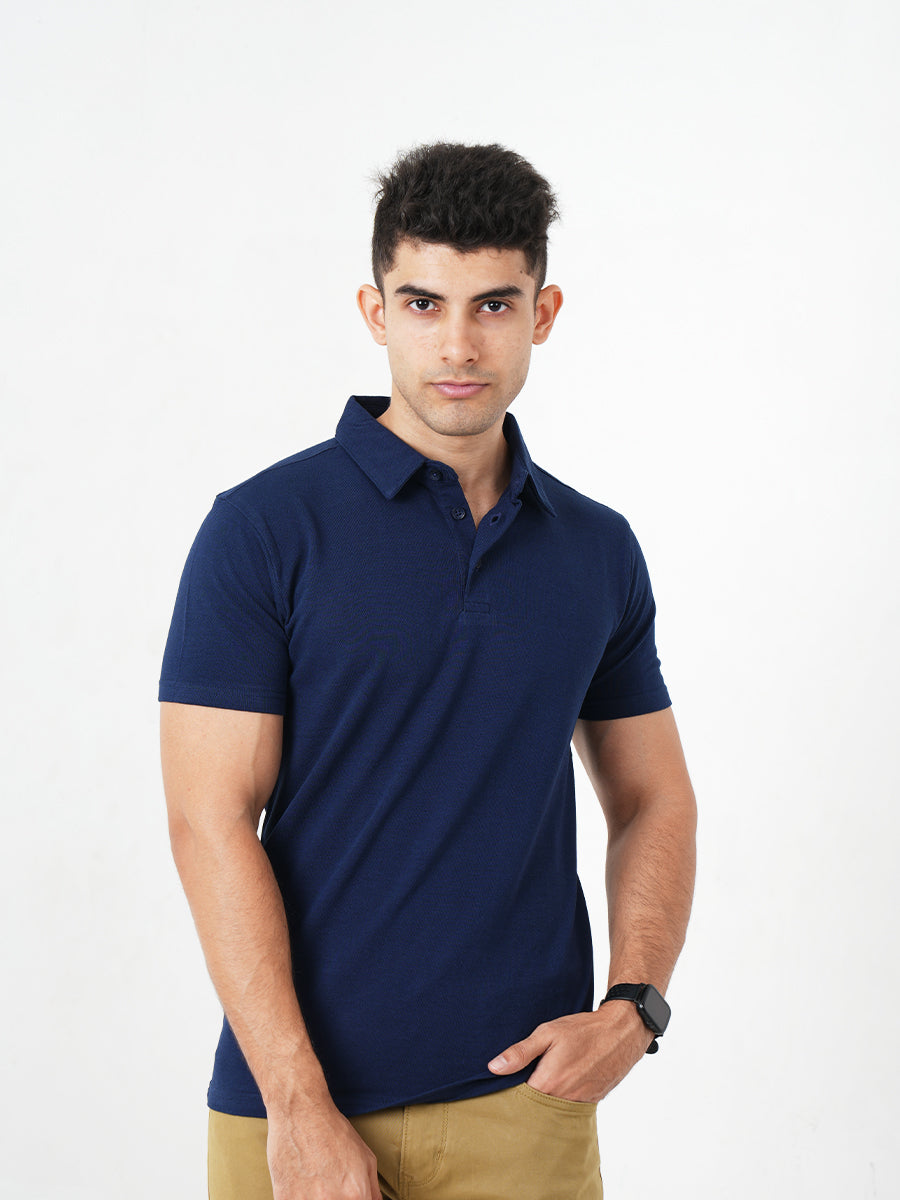 A man in a comfortable Monkstory Bamboo Cotton Polo Tee - Navy Blue posing for a photo.