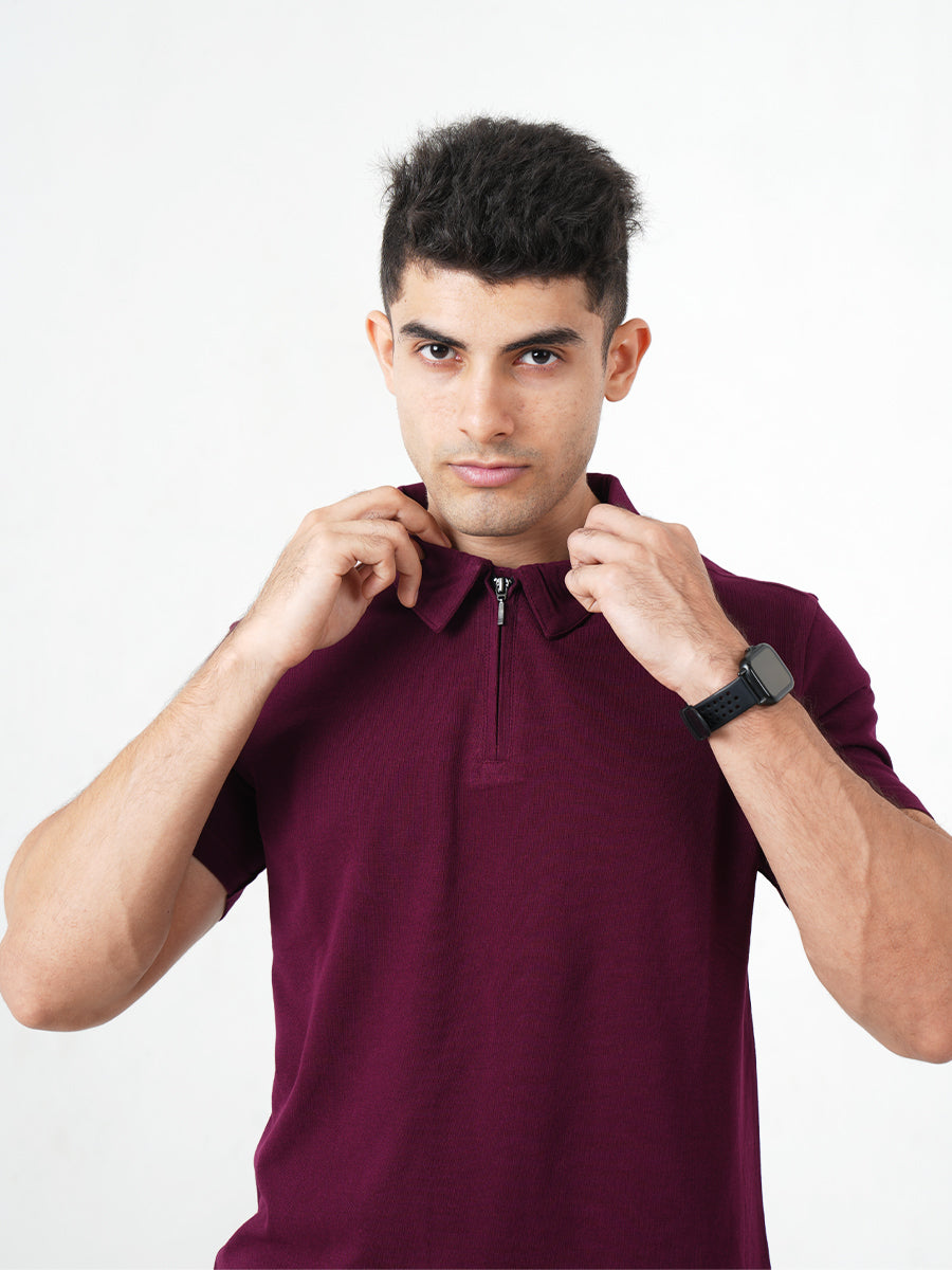 A man wearing a Monkstory Bamboo Cotton Zip-Polo Tee in Mauve Wine shade.