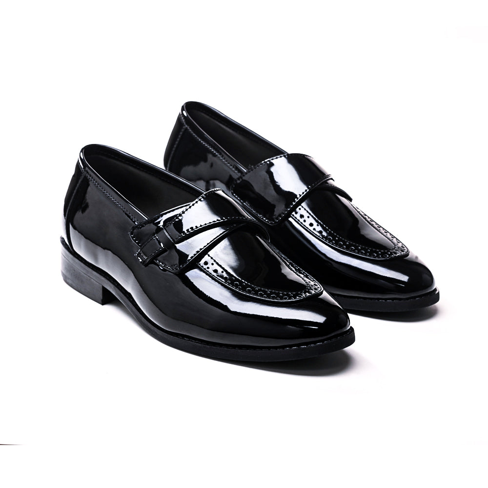 A pair of Drezzire Classic Patent Slip-Ons - Black from monkstory on a white background.