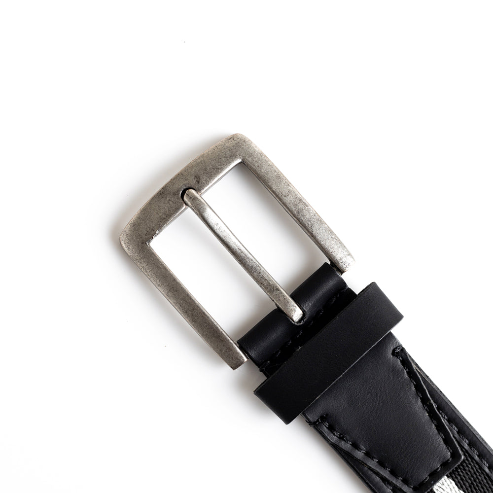 A MONKSTORY vegan belt with a silver buckle.