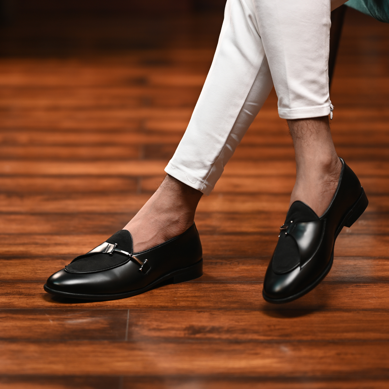 An Eclecta Side Buckle Slip On - Black/Black made of vegan leather.